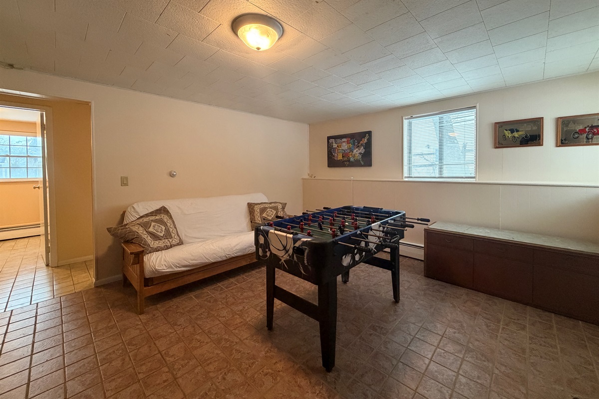 Lower level gameroom with 2nd bathroom beyond