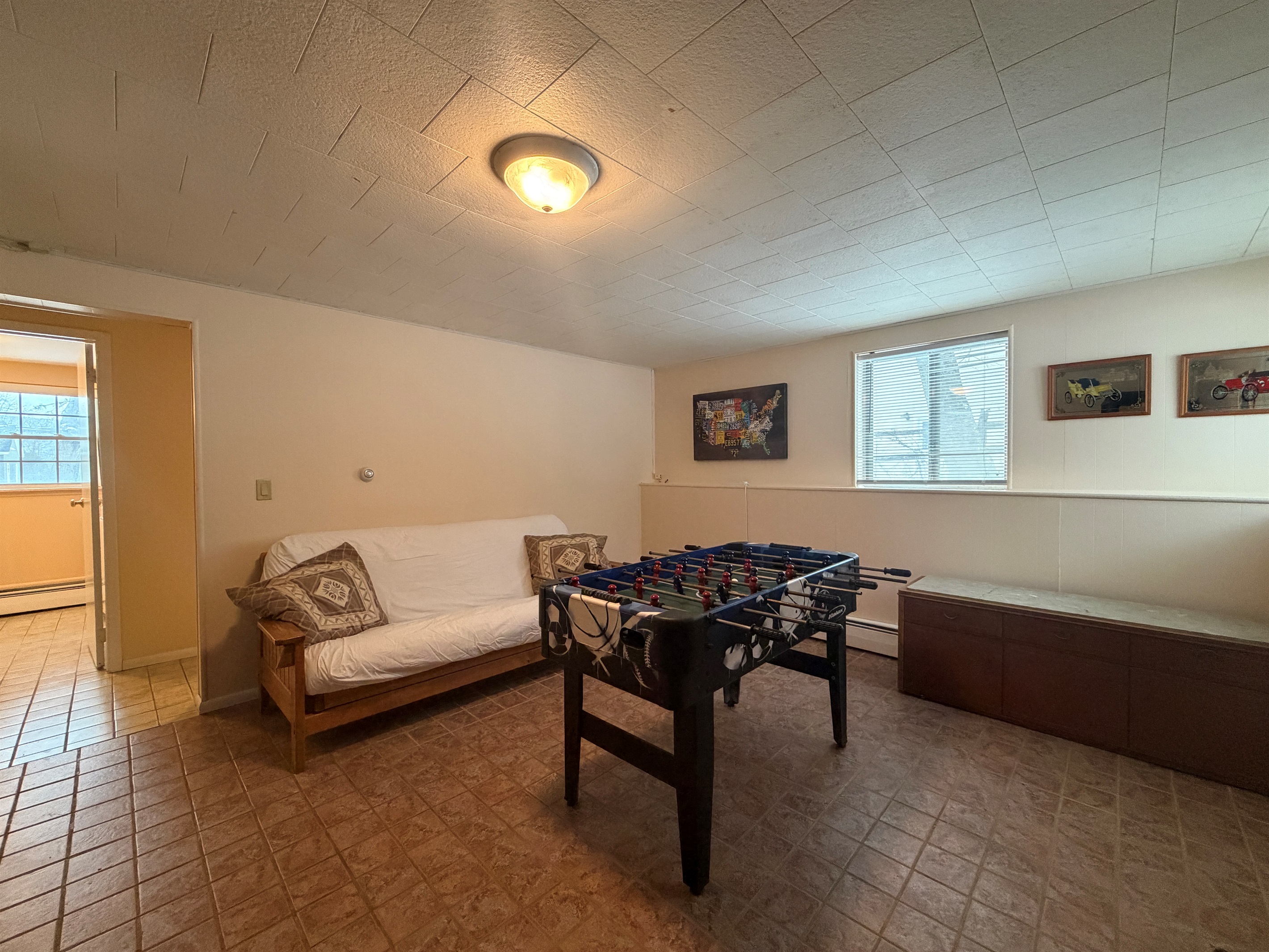 Lower level gameroom with 2nd bathroom beyond