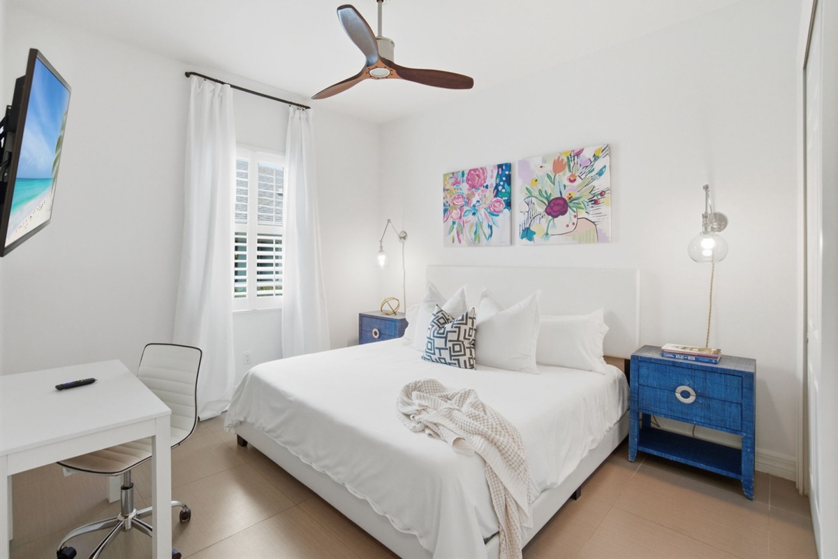 2nd master suite with king bed, private bathroom, and desk