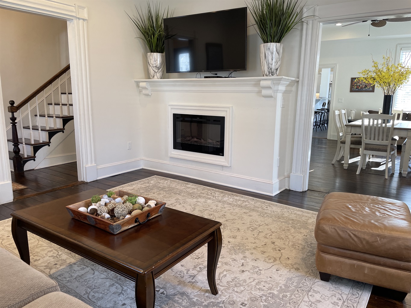 Easy flow from entry hallway to living area to dining area