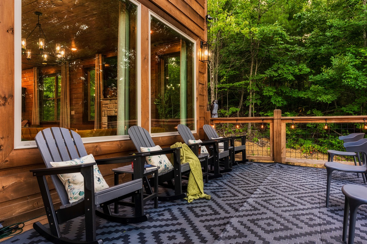 Spacious deck with string lights, and nature views
