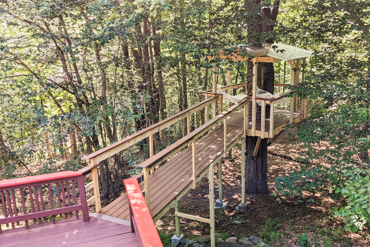 Treehouse with hammocks accessible from deck
