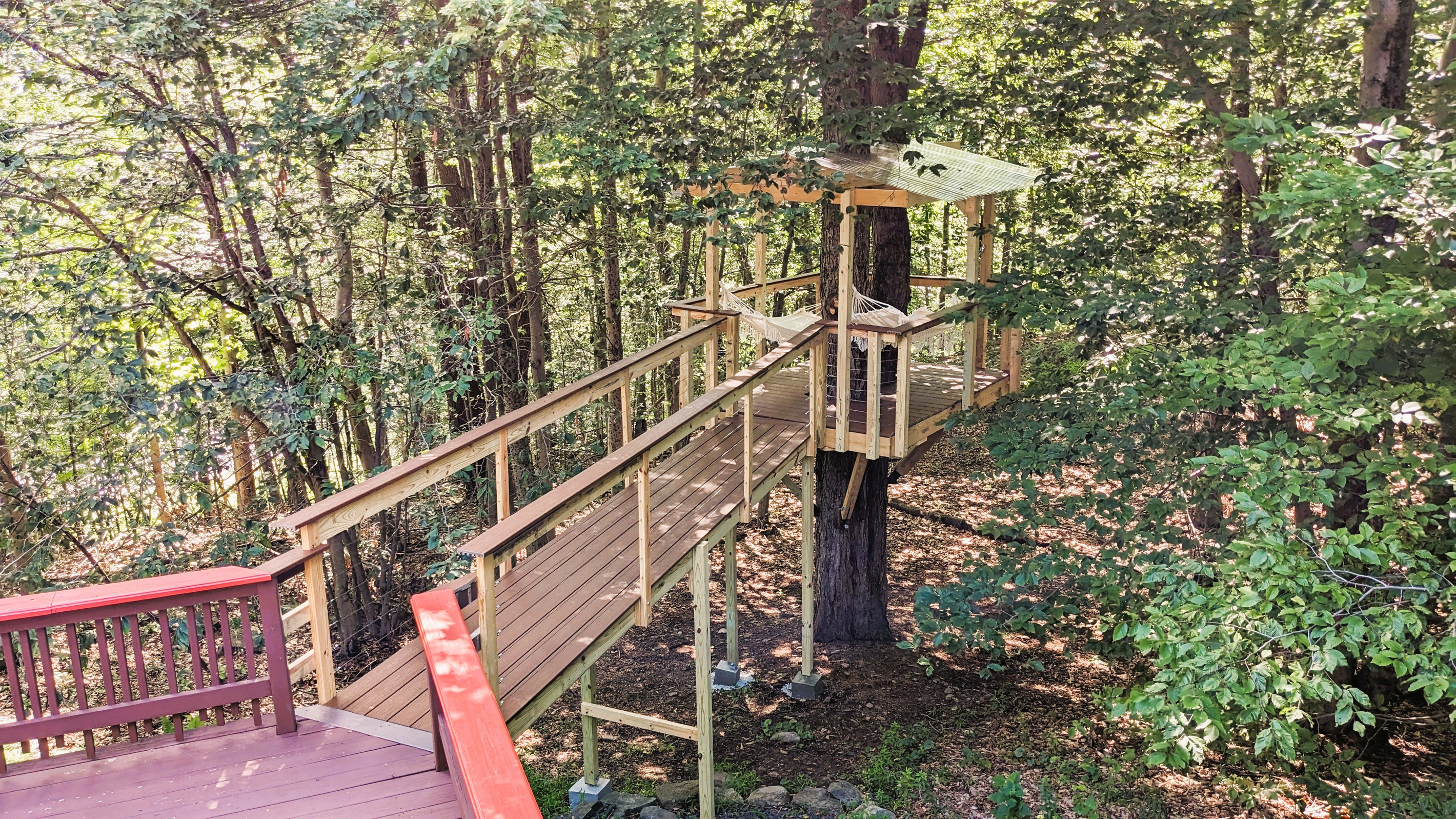 Treehouse with hammocks accessible from deck