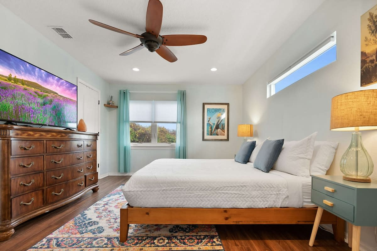 King bed, chest of drawers, ceiling fan and a smart TV. Room enough to actually unpack and settle in, which is what turns a week away into something that feels properly like living somewhere else entirely.