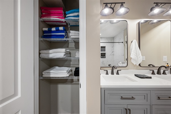 The master bath linen closet is stocked with bath towels, hand towels, wash cloths, makeup cloths, and hot tub towels—everything you’ll need for a comfortable stay.