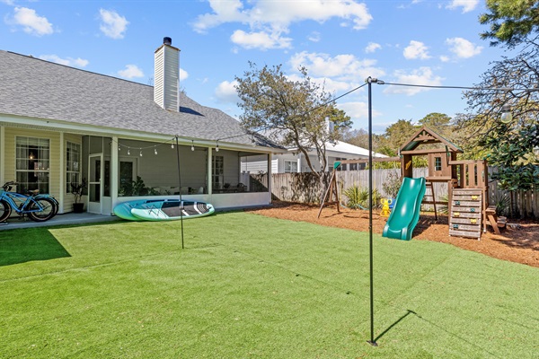 Fully fenced and full of fun- kids love the play set, and you'll love the worry free turf yard.