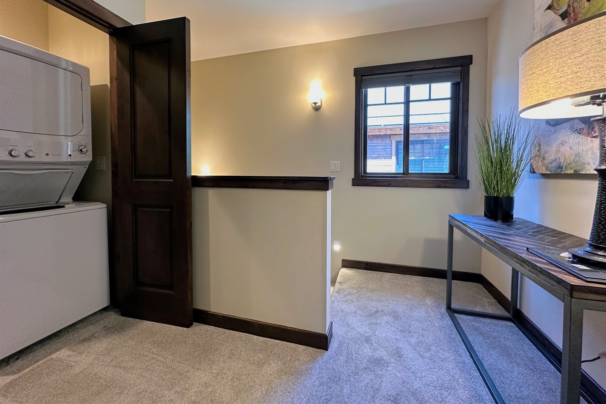 Laundry’s a breeze with the washer and dryer tucked into the stylish third-floor foyer.