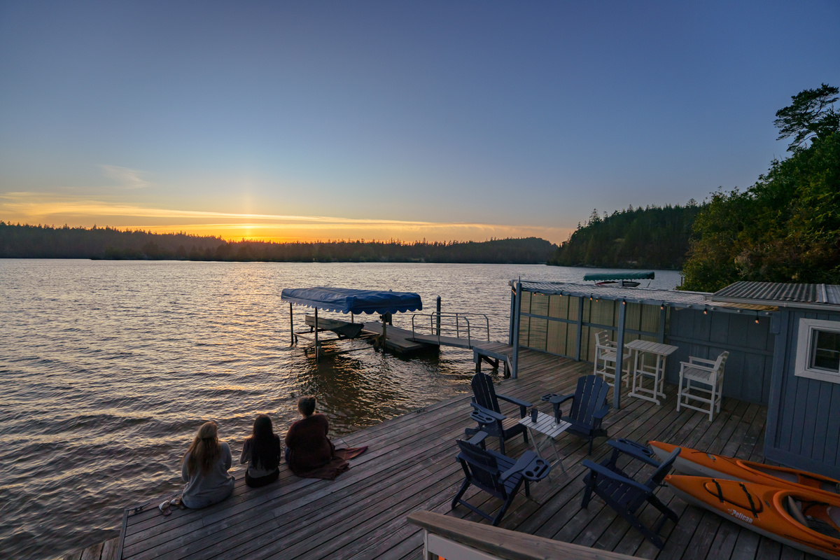 Your private waterfront oasis awaits—launch a kayak, lounge beside the lake, or gather on the spacious dock as the sun sets over beautiful Woahink Lake.