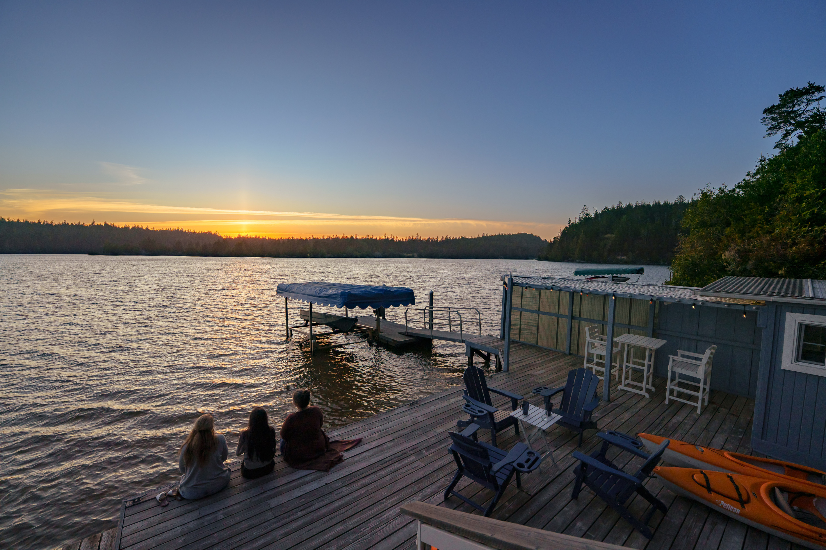 Your private waterfront oasis awaits—launch a kayak, lounge beside the lake, or gather on the spacious dock as the sun sets over beautiful Woahink Lake.