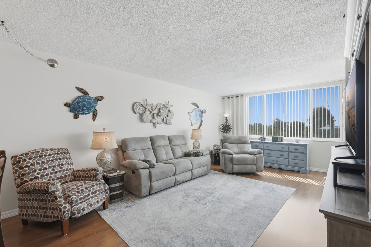 With an open and inviting layout, the living area is a comfortable place to gather, relax, and enjoy a slower pace of coastal living.