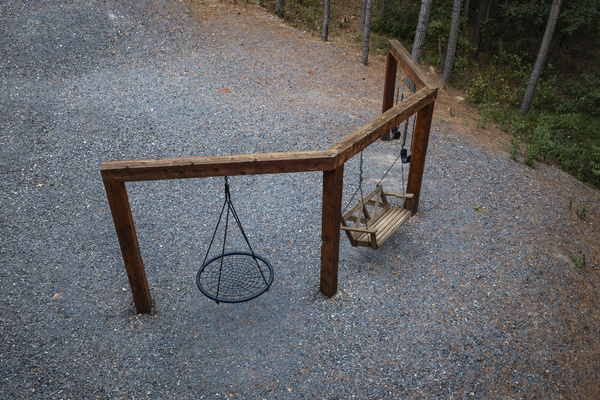 Breathe in the fresh forest air while the kids enjoy the outdoor swings just steps from the cabin.