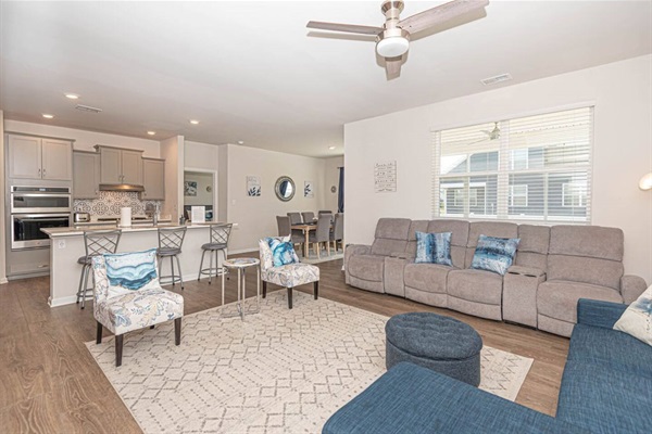 Welcome to our living room! With a plush recliner, sleeper sofa for 2, 2 chic chairs, an electric fireplace, and a 65" smart TV, it's your ultimate spot for relaxation and entertainment. ️