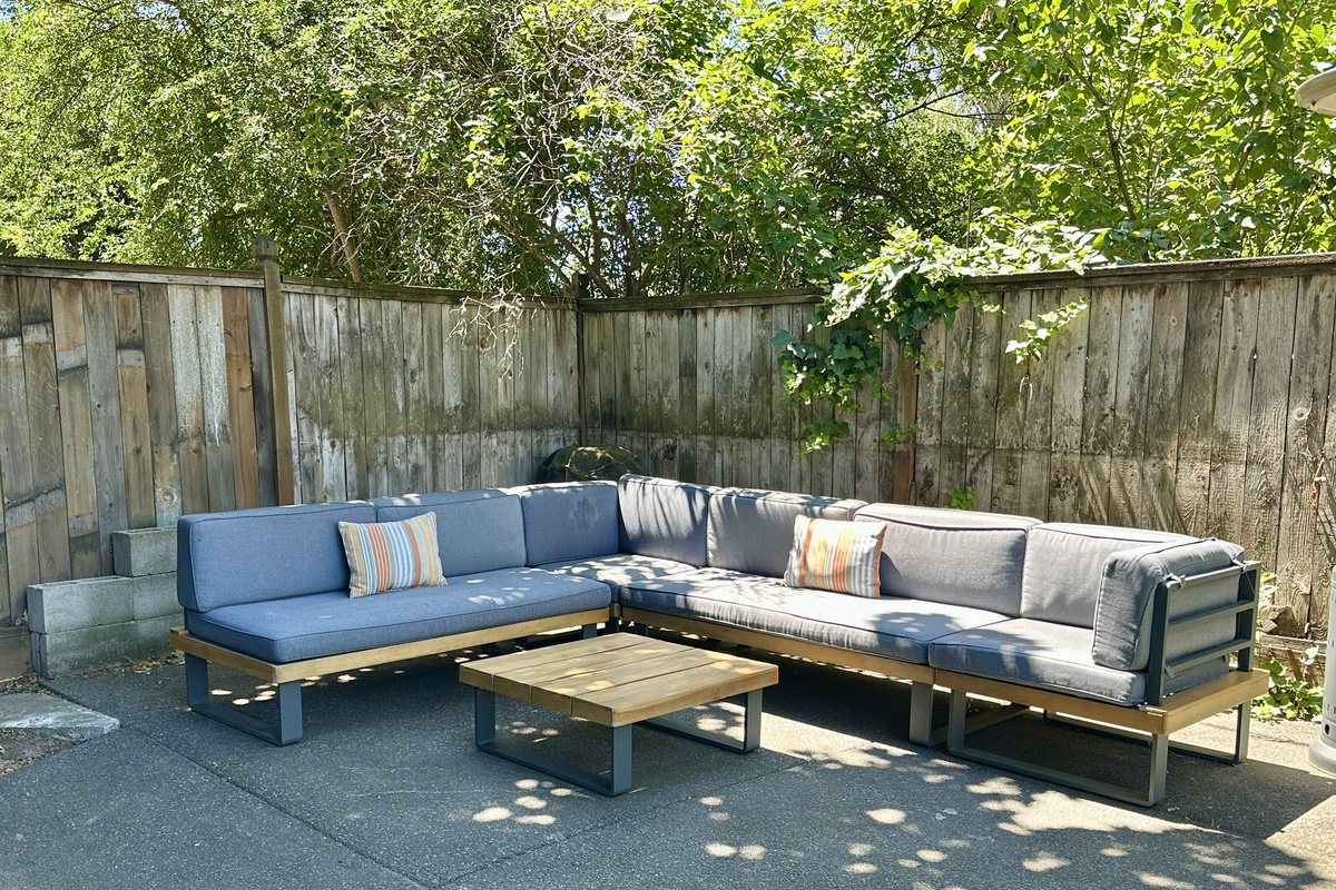 Relax on the lounger in the shaded back yard!