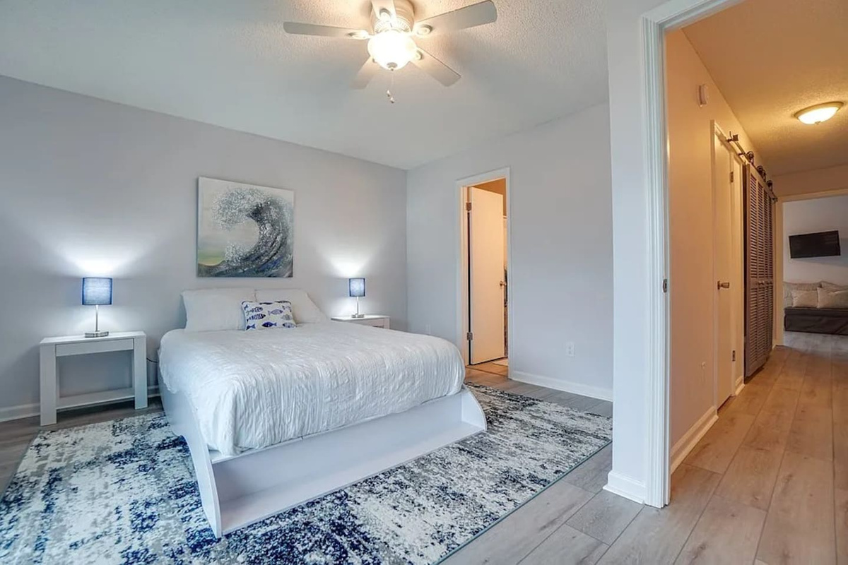 Your own private suite &mdash; queen bed, ensuite bath, and a deck that opens to the Gulf. No shared bathrooms, no compromises.