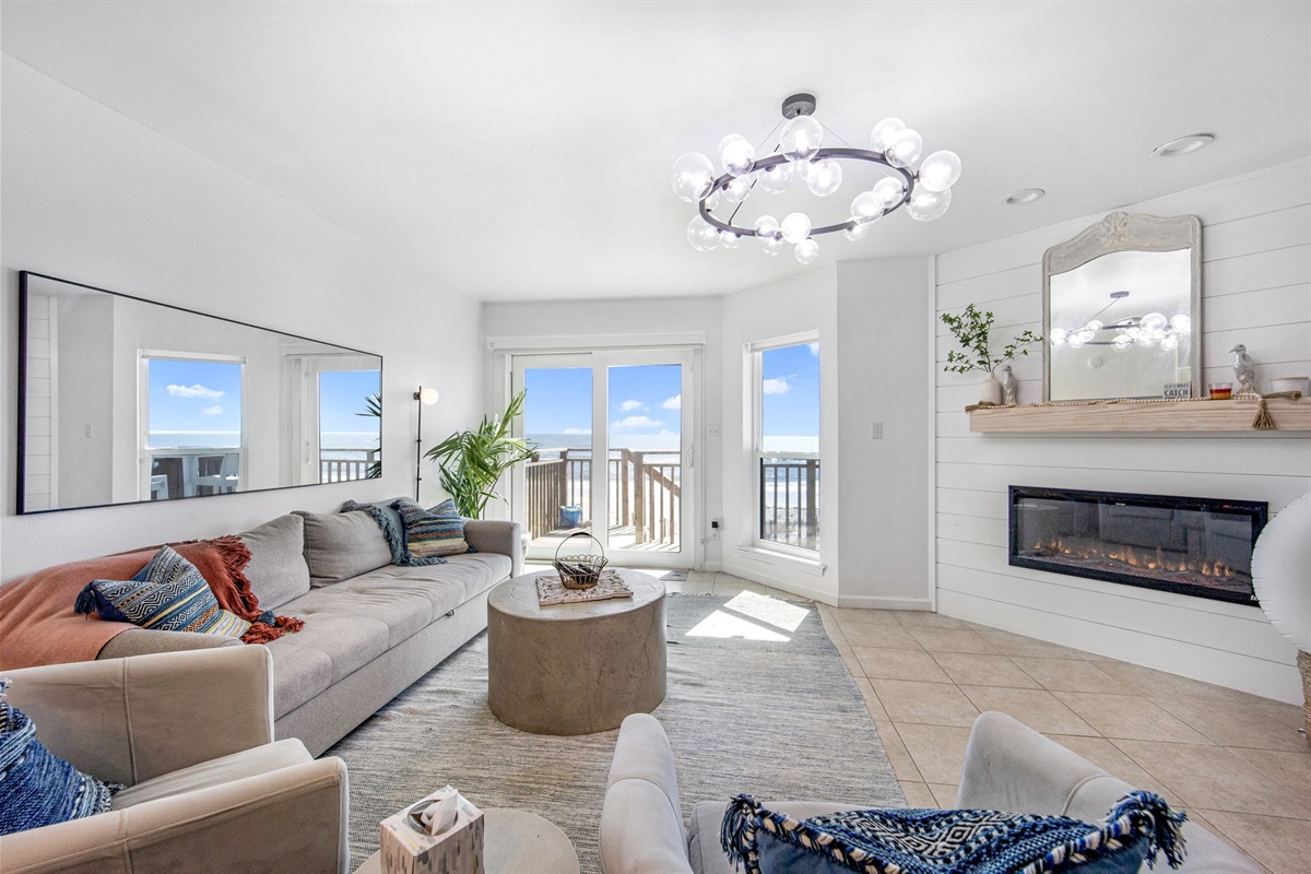 *Living room with Queen Sofa Sleeper and Frame TV* This living room with a Gulf view is more than just a room; it's a sanctuary where you can escape the hustle and bustle of daily life