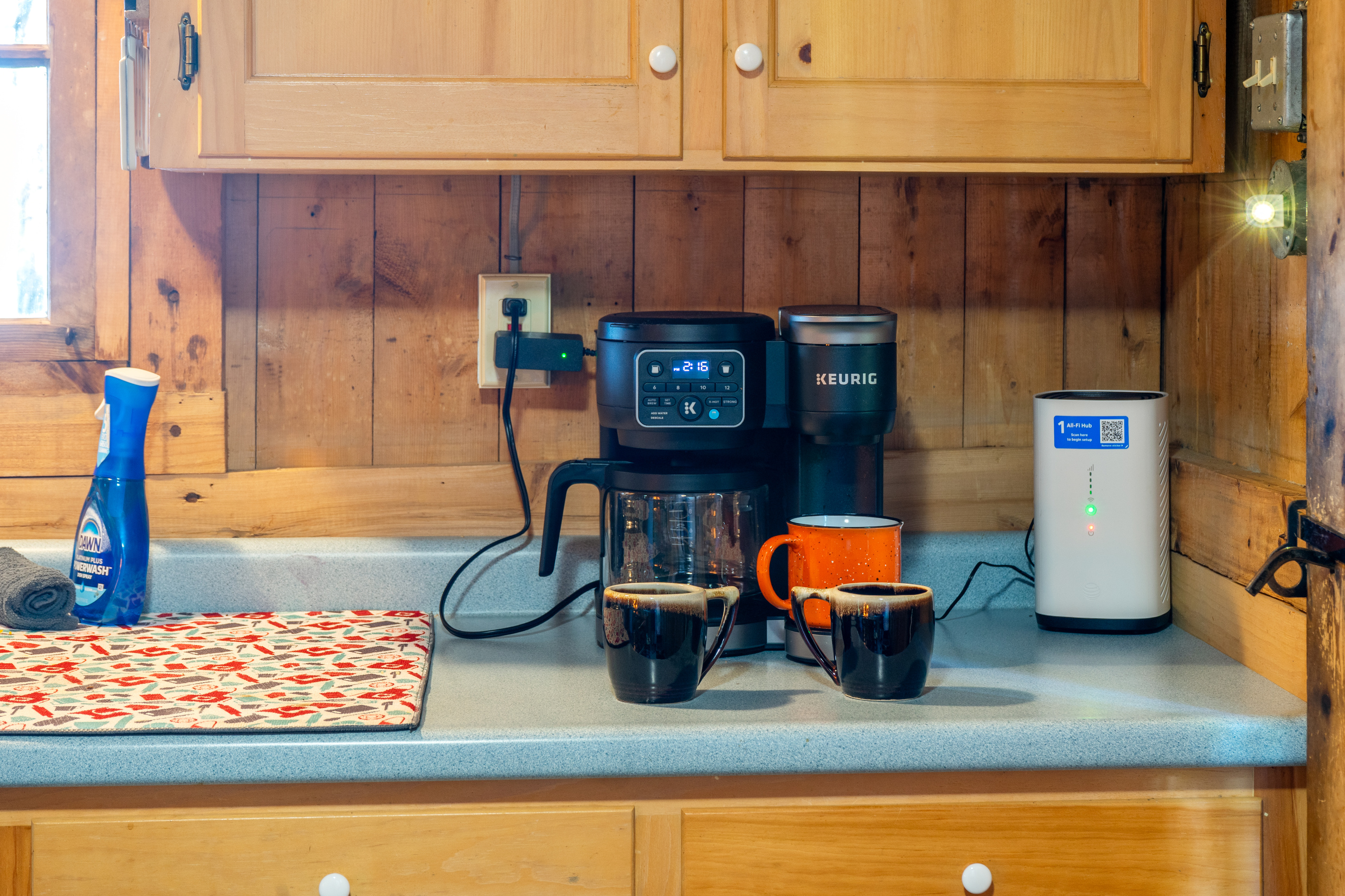 Coffee bar station at Loonrise Point! Features a dual-function Keurig K-Duo for single-serve pods or full carafe brewing, plus high-speed Wi-Fi router for easy connectivity on Beech Hill Pond in Otis, ME. Start your morning right!