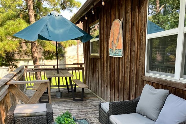 Front Deck table for 6 and patio seating.