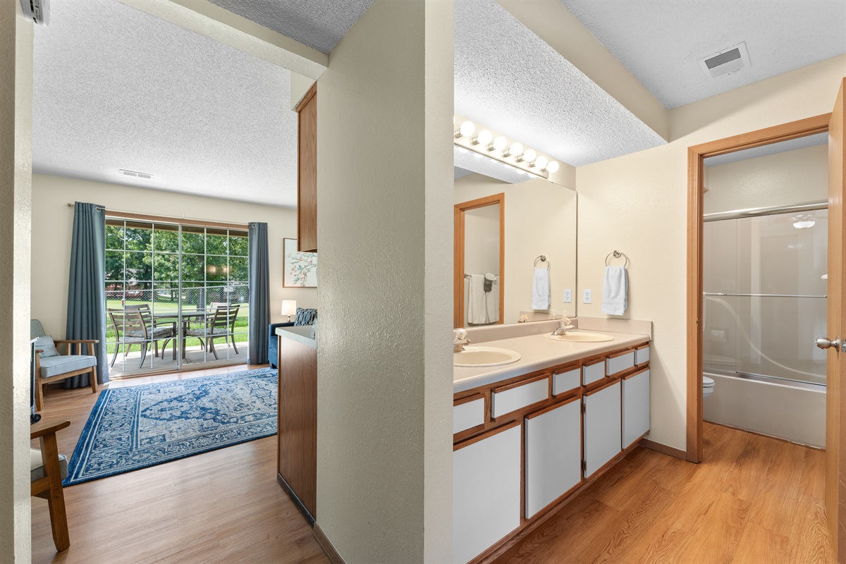 Dual-sink vanity and full tub/shower combo—ideal for families or couples.