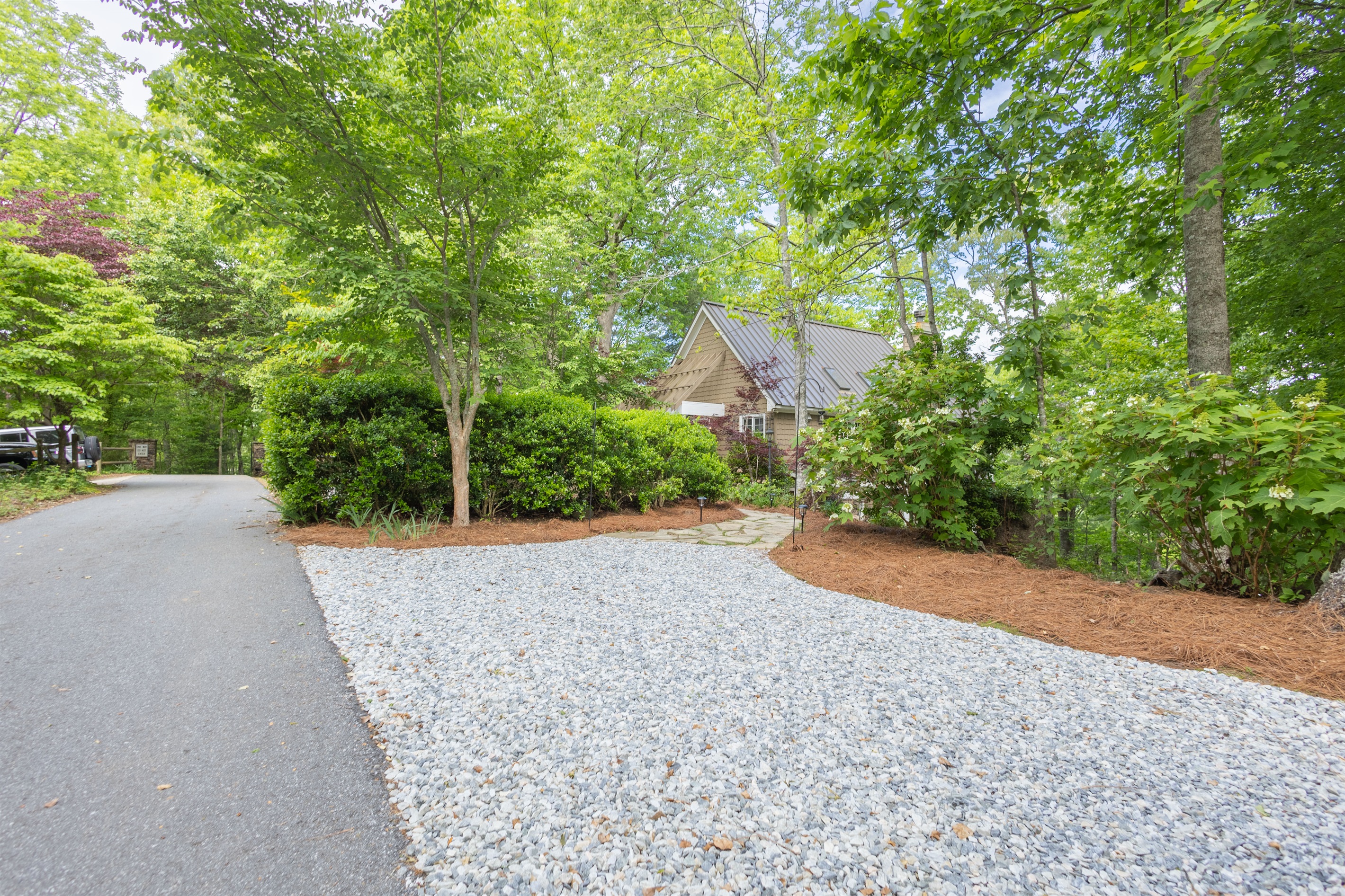 Plenty of gravel parking is available, making it easy for guests to spread out and access the home comfortably.