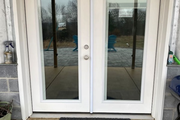 Detail of French doors from paver patio.