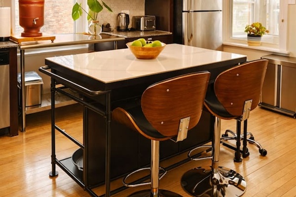 Modern kitchen with full appliances and plenty of space to cook and gather.