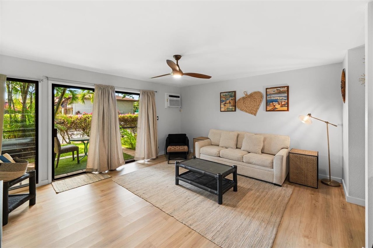 Spacious living room leading onto tropical lanai
