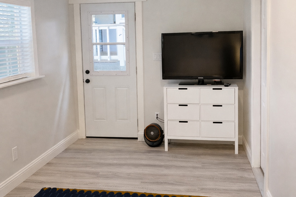 Enjoy added privacy in the detached guest bedroom, located just 10 feet from the main house. This comfortable retreat features a queen bed, Smart TV, and air conditioning, making it the perfect space to relax and unwind while staying close to the rest of y