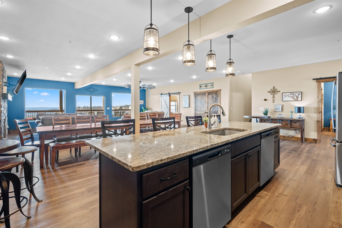 Bright open-concept kitchen with granite island and plenty of seating for everyone