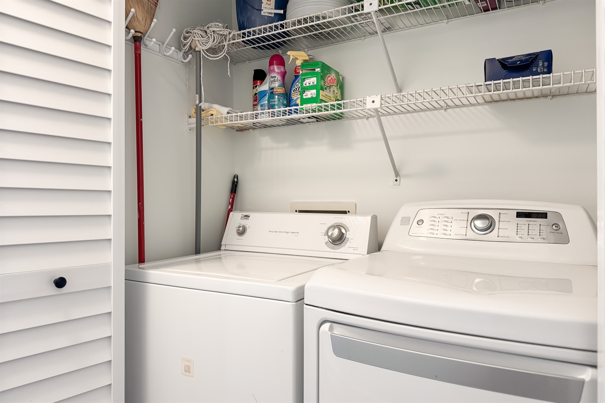 This well-equipped utility closet offers ample storage and a in-unit washer/dryer for your everyday needs.