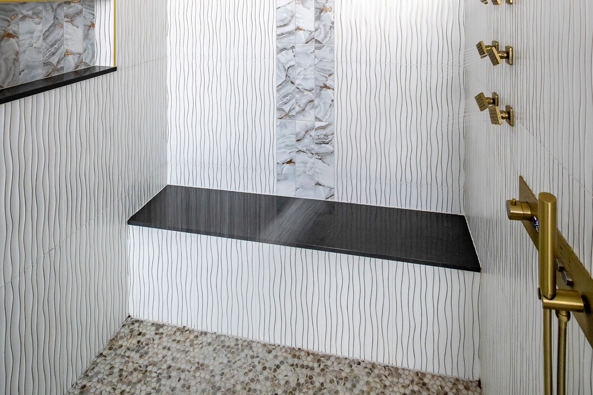 Luxury en-suite bathroom with 2-person air massaging bath, tiled rain shower, and double vanity