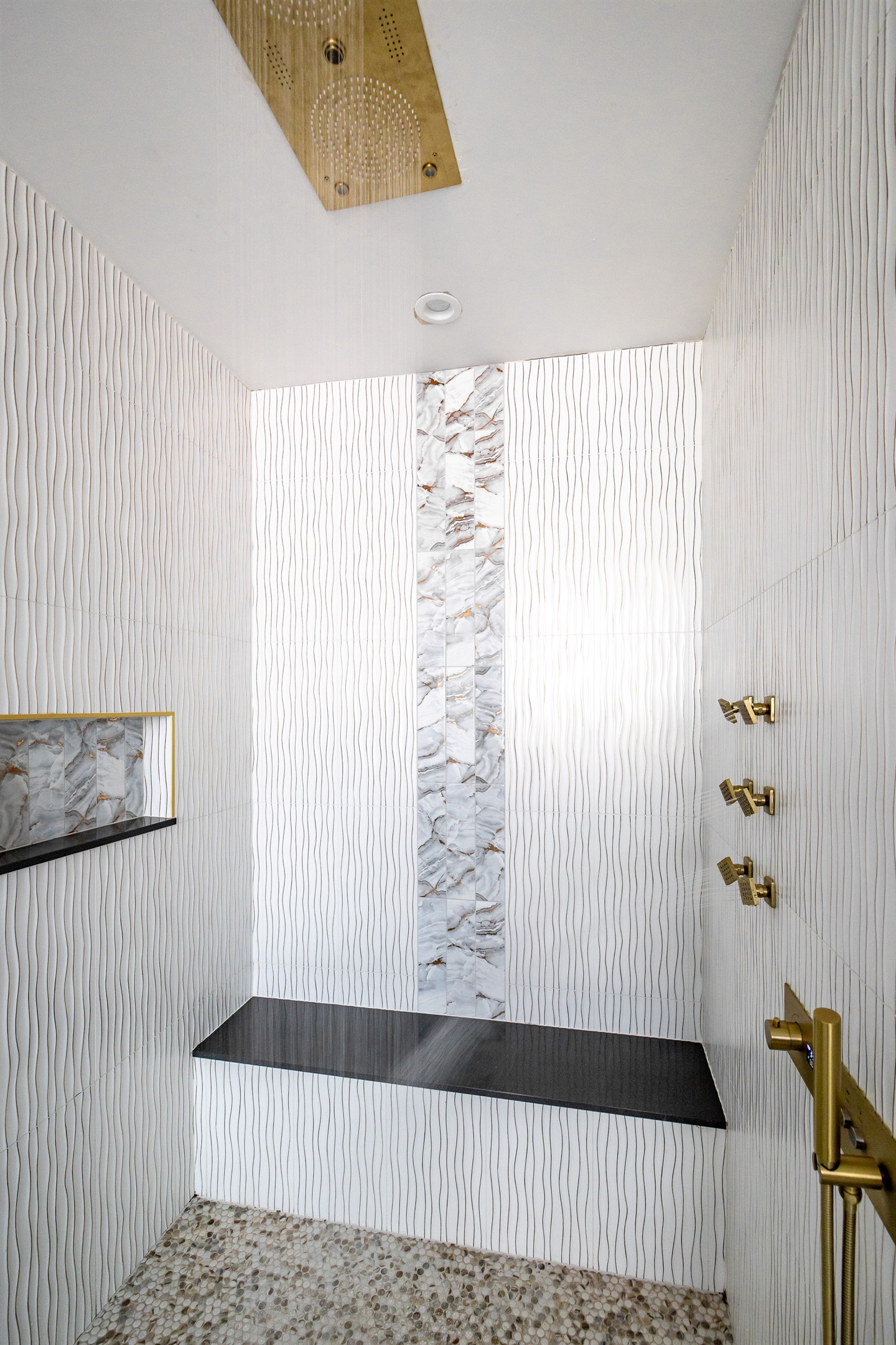 Luxury en-suite bathroom with 2-person air massaging bath, tiled rain shower, and double vanity