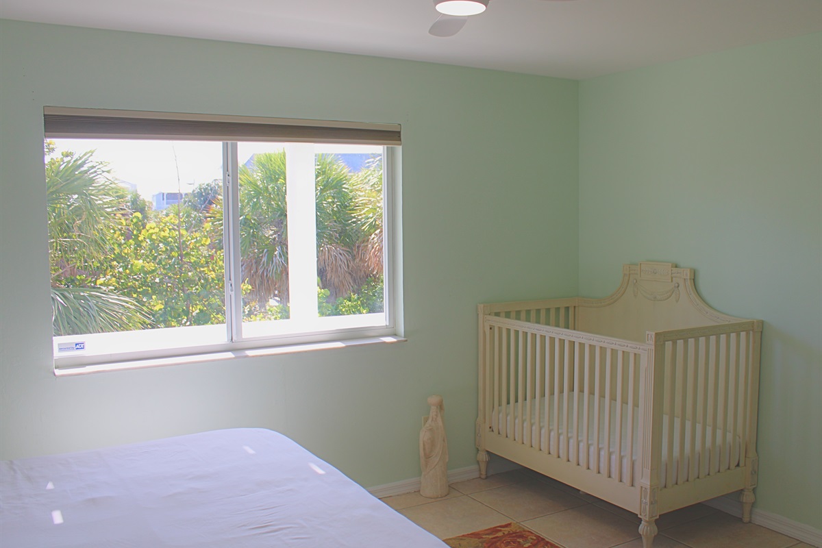 A crib is located in bedroom #4, perfect for young families.