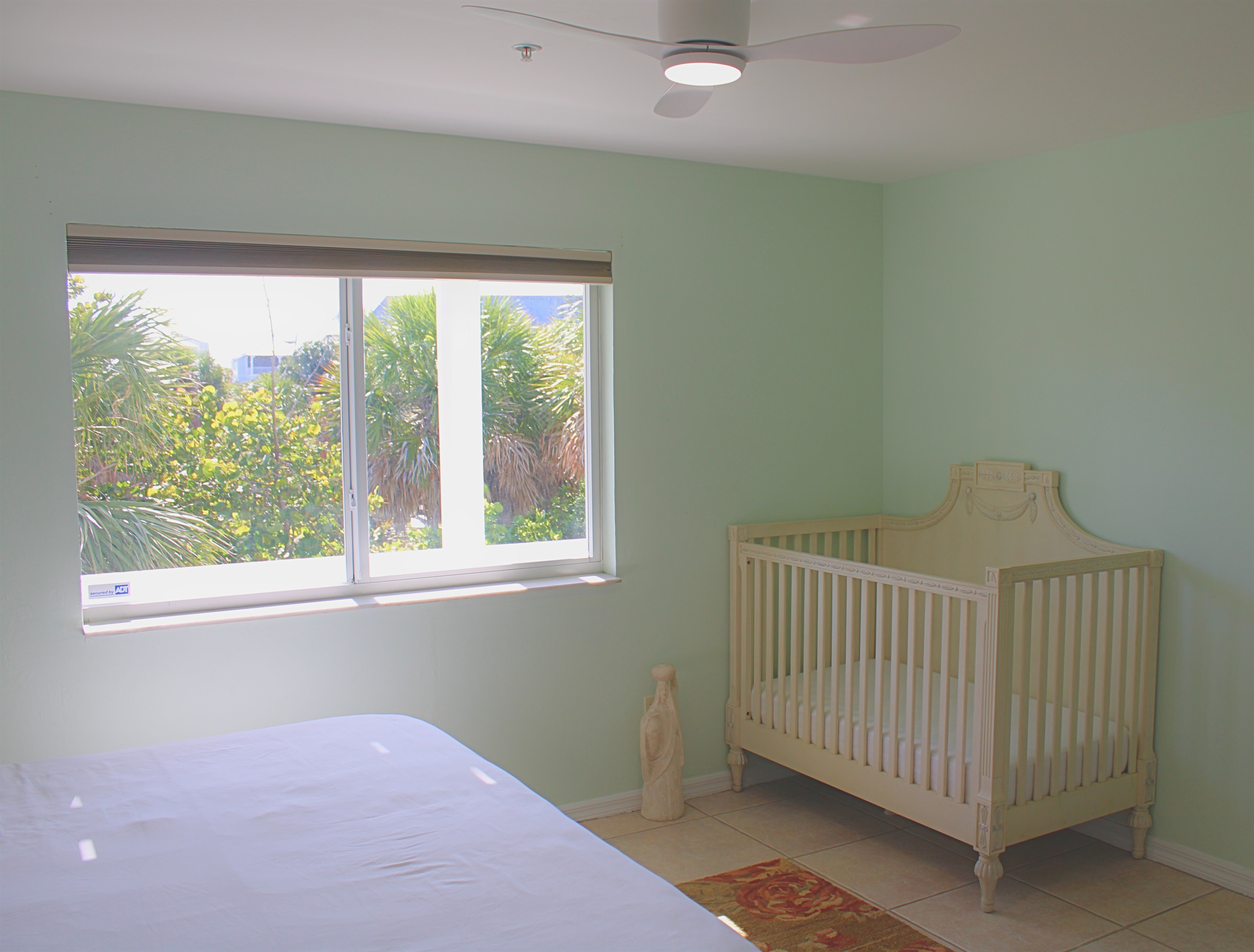 A crib is located in bedroom #4, perfect for young families.