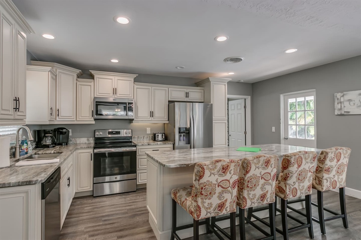 Prepare a Wonderful Meal in this Gorgeous Kitchen with Granite and Stainless Steel