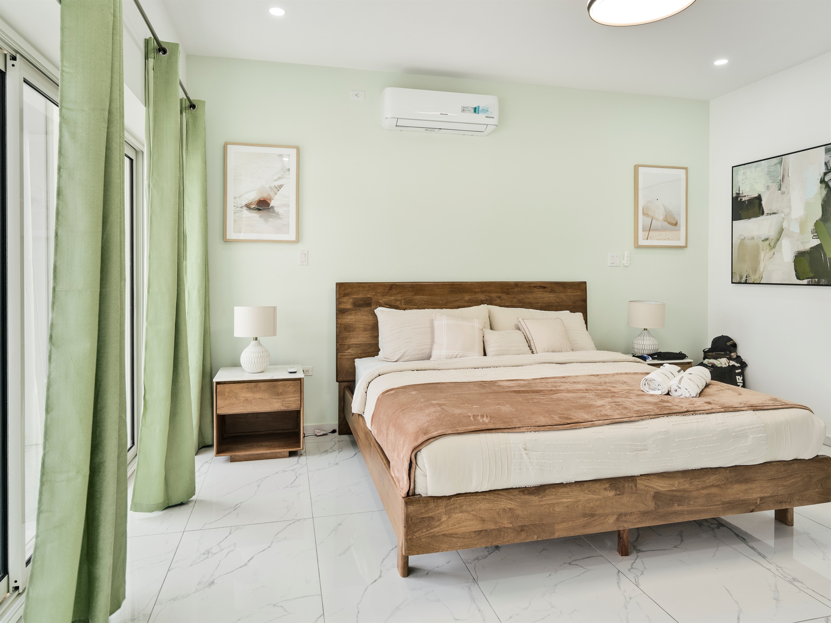Tranquil Bedroom with Natural Wood Bed & Soft Green Accents