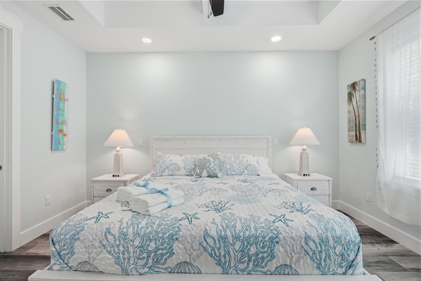 Relax in your main king bedroom at the end of a long day with a book.