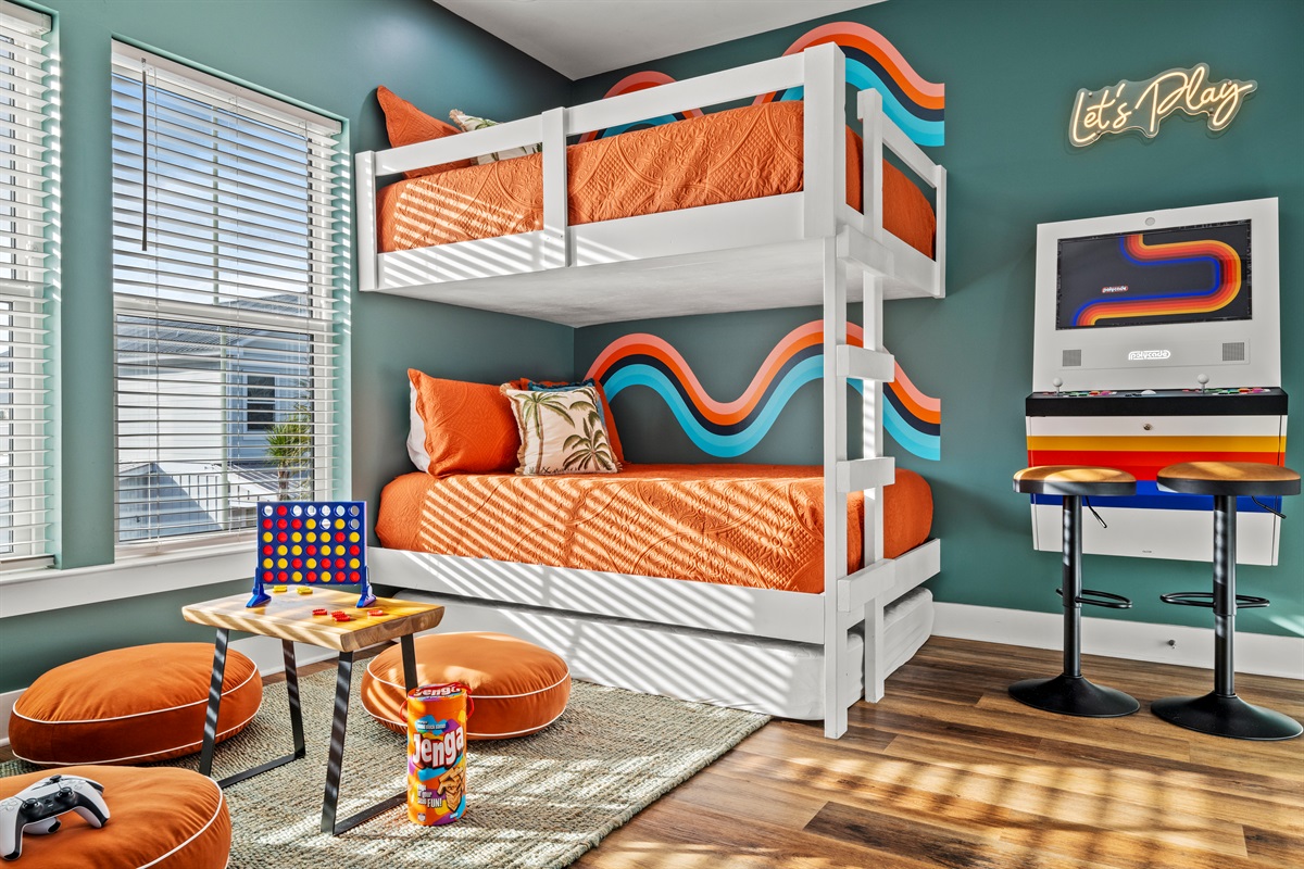 The ultimate kids bunk room. Built in bunks, arcade games, and space to play make this a favorite hangout for little guests after a beach day.