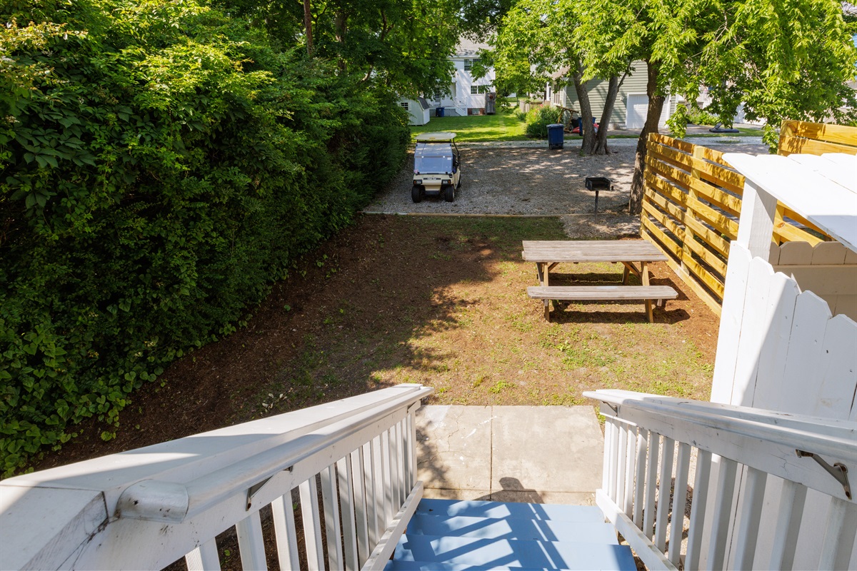 Shared backyard offers additional parking. A BBQ grill and outdoor seating have been recently installed behind the house on each side as well.