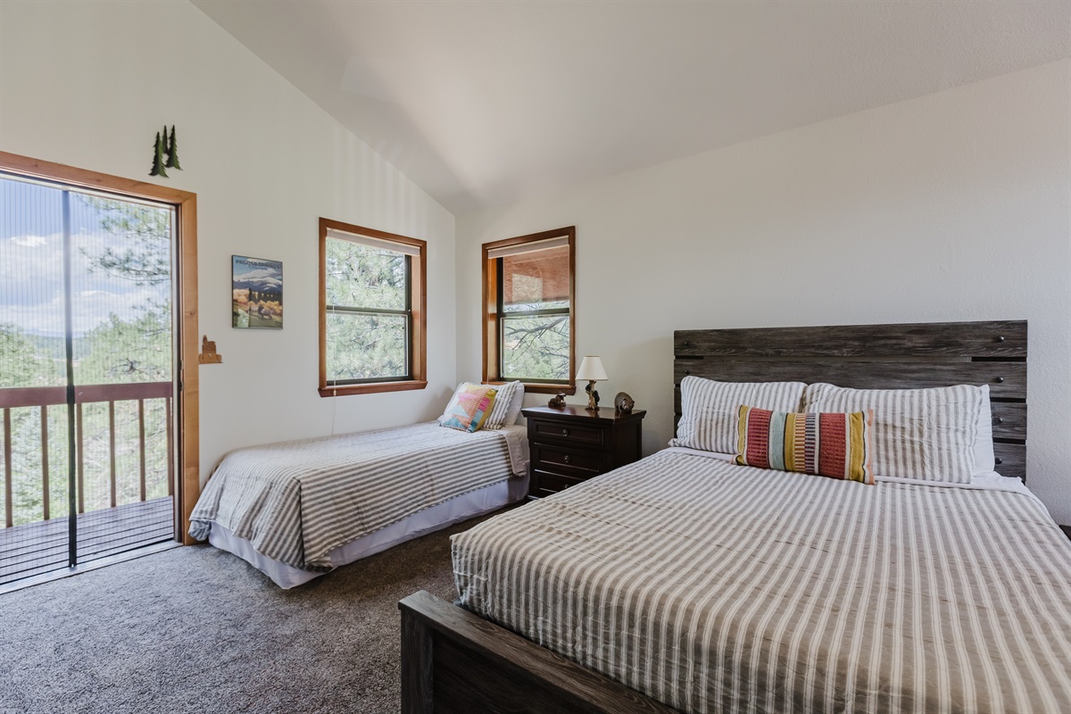 This airy loft offers extra sleeping space with a twin and full bed, ideal for families or friends. Step onto the private balcony to take in crisp mountain air and endless views — it’s a peaceful perch above the trees.