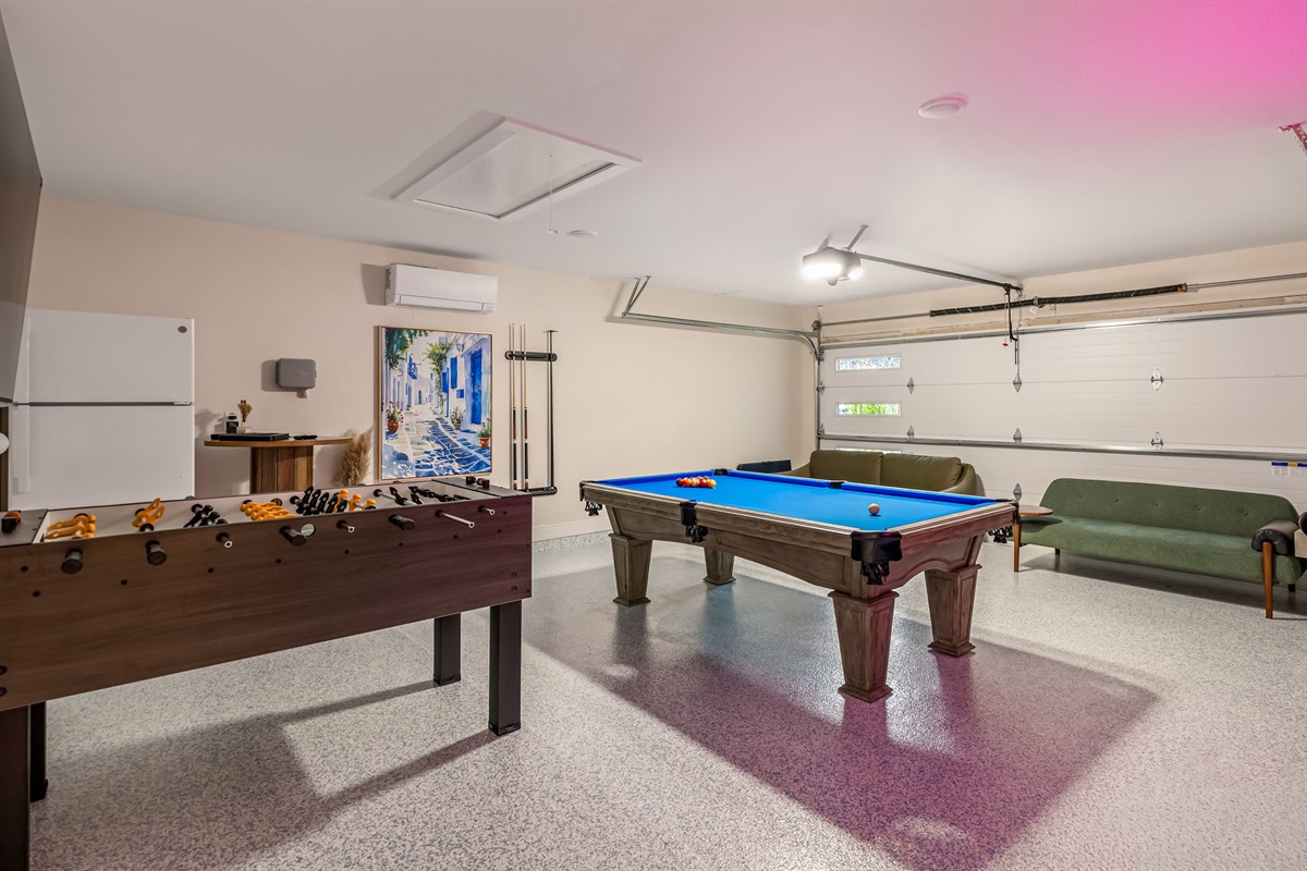 Spacious garage game room with pool table and foosball — hours of indoor entertainment for your group.