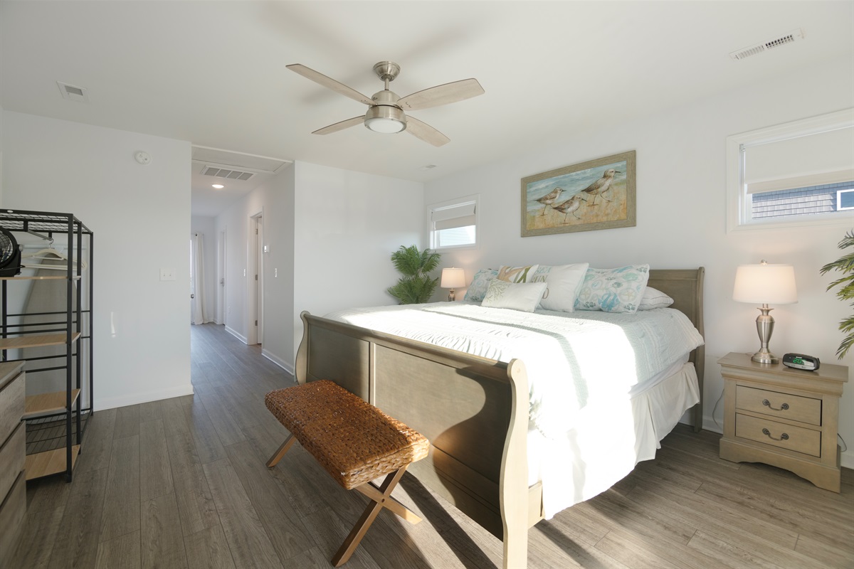 Wake up to sunshine and king comfort in this light filled bedroom