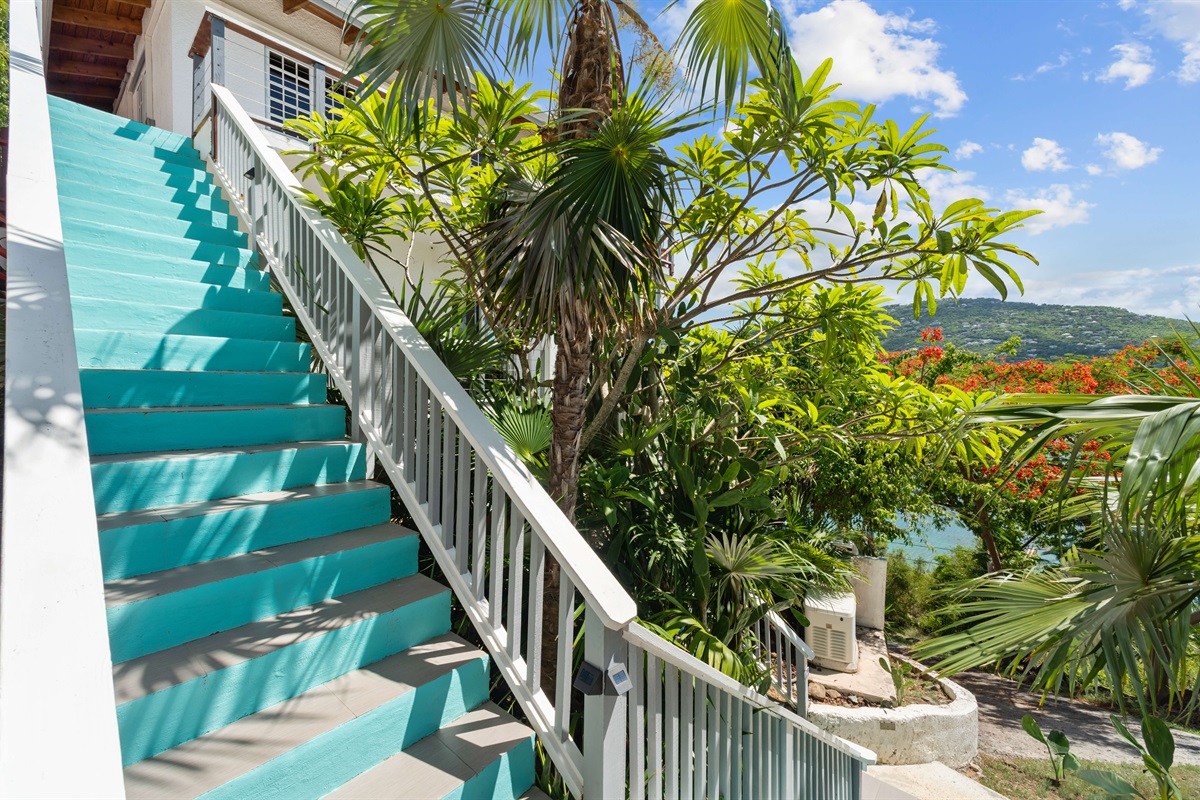 The stairs that lead up to the main wrap around deck to the front door.