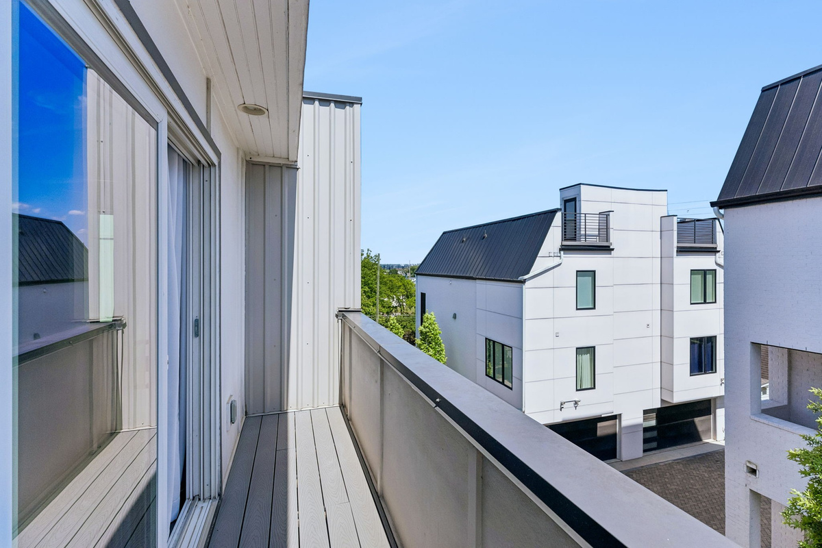 Your front-row seat to the Nashville skyline &mdash; 1.5 miles from downtown, visible from the primary bedroom patio every single day.