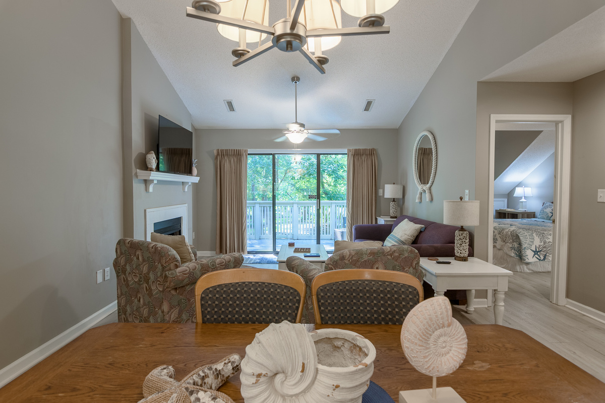 Open concept living room/dining room area with seating for 8