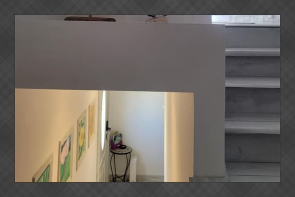 Hallway stairs to the common area where there are extra items to be shared between 2 apartments: additional cookware, laundry facilities, beach equipment, games, emergency supplies, etc.