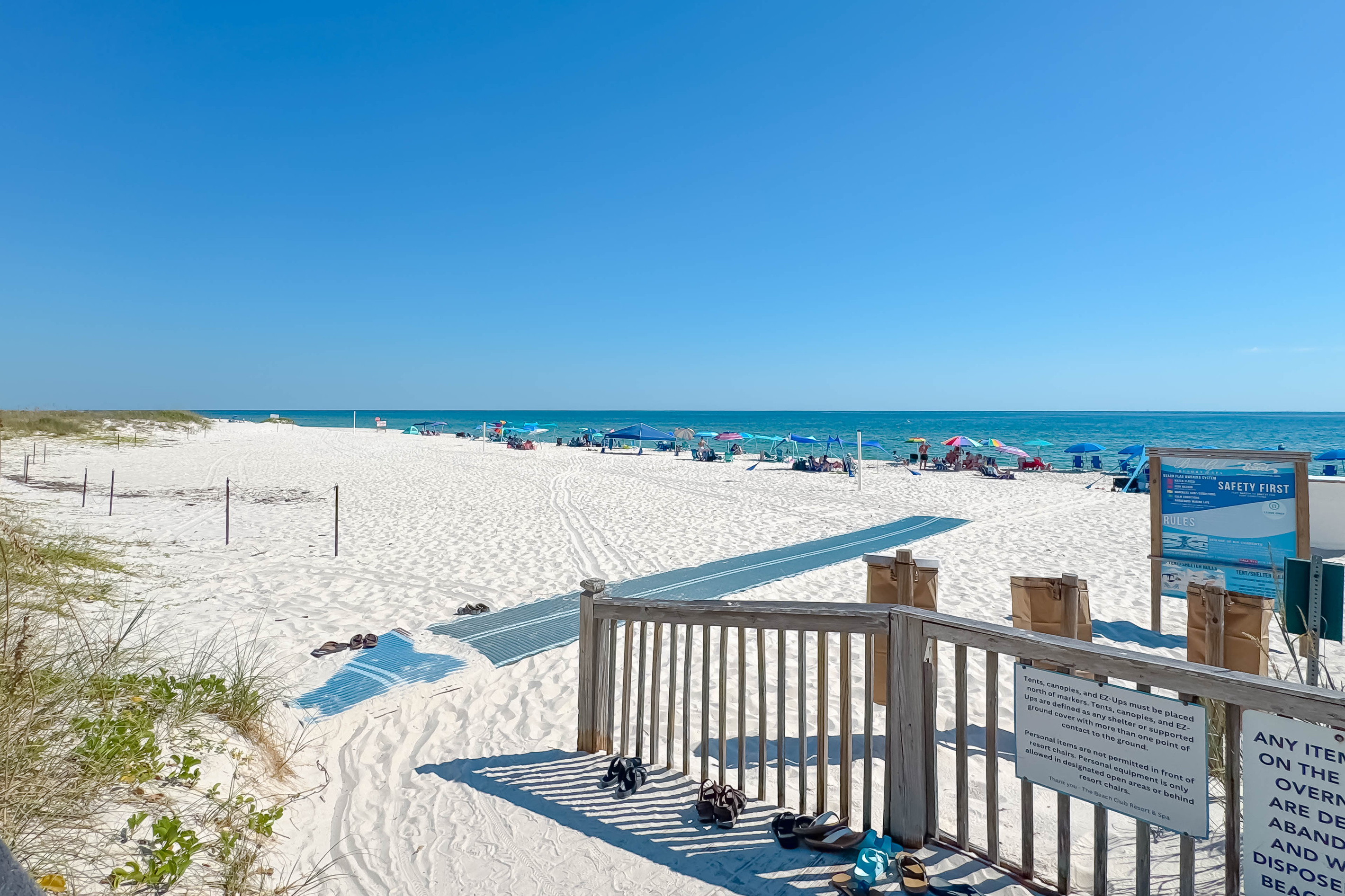 Directly on the sands, this beachfront building offers unparalleled access to the shore and stunning coastal views.
