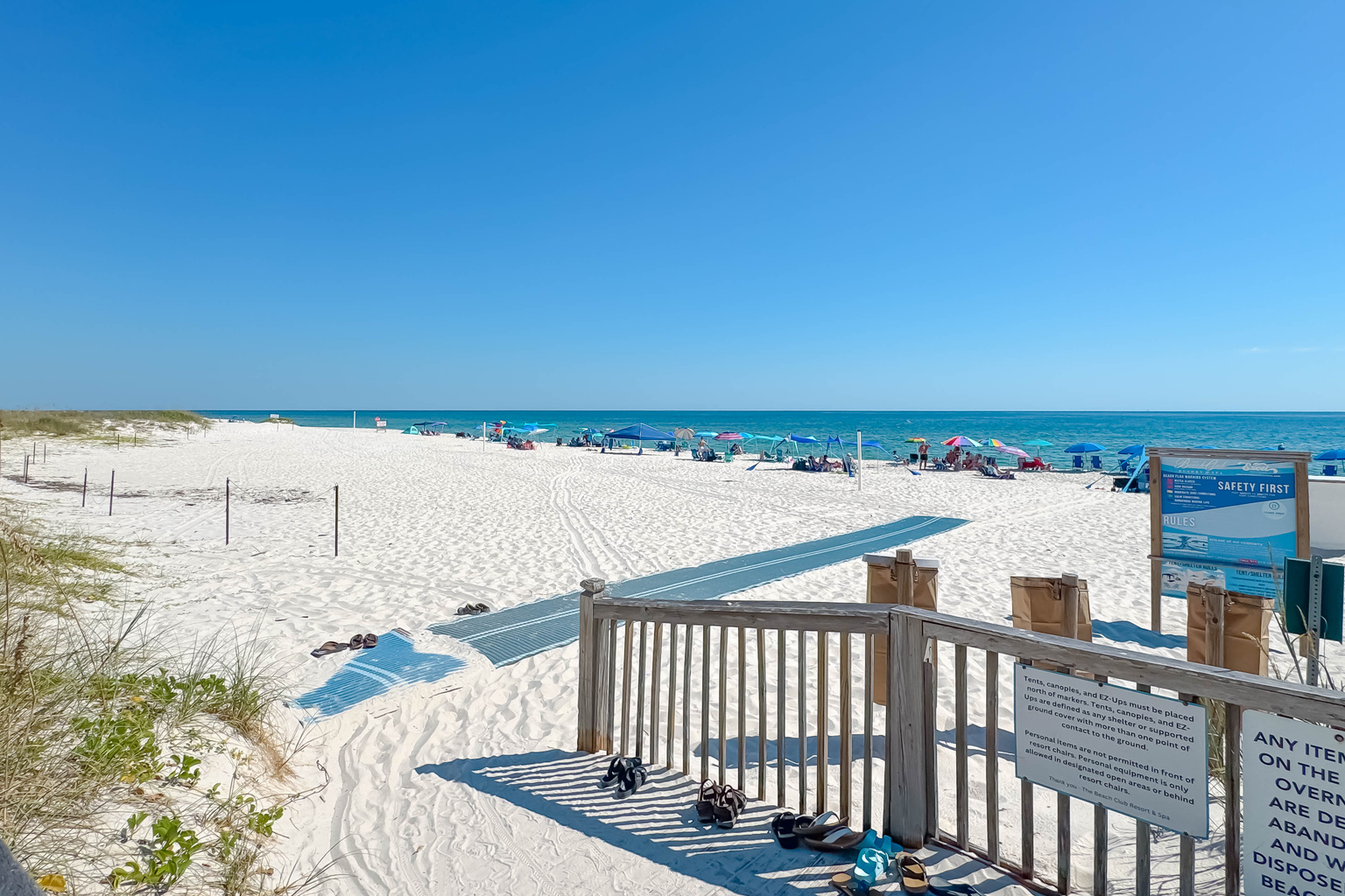 Directly on the sands, this beachfront building offers unparalleled access to the shore and stunning coastal views.