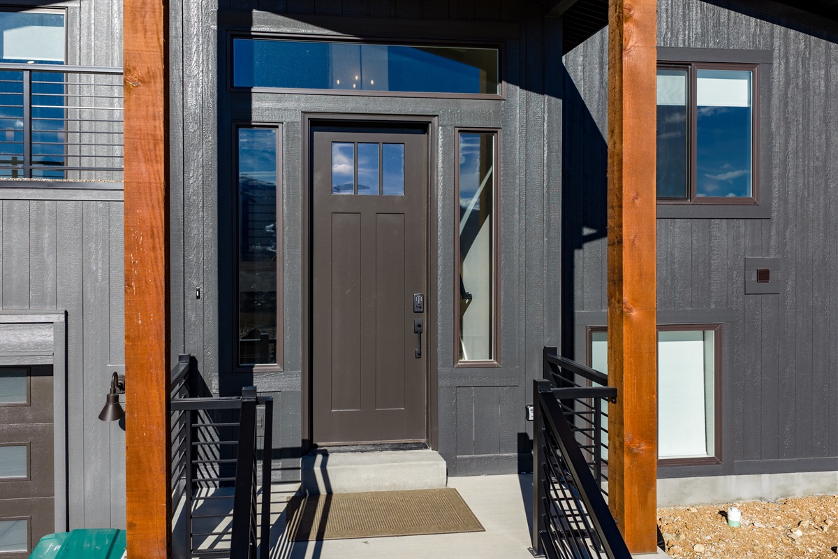 Covered front entry with clean, modern details and design.