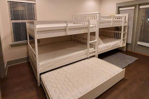 Bedroom 3 with two full over full bunk beds one trundall
