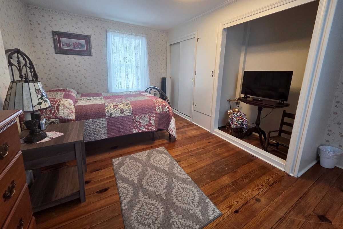 Third Upstairs bedroom featuring a comfortable full bed, with convenient access to the shared Jack-and-Jill bathroom.